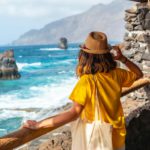 A tourist looking at the pools from the recreational area of La Maceta on the island of El Hierro