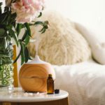 Aroma oil diffuser on chair against in the bedroom. Air freshener.