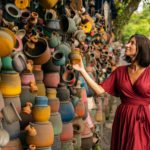 Cheerful young woman walking on local market