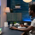 Entrepreneur man sitting at desk table analyzing global economy investment