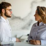 Young couple having serious relations communication problems