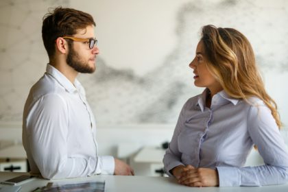 Young couple having serious relations communication problems