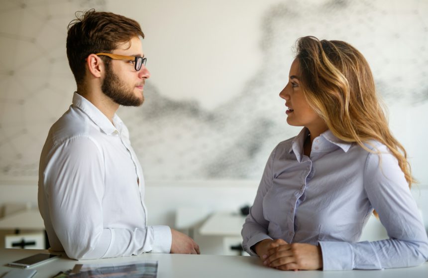 Young couple having serious relations communication problems